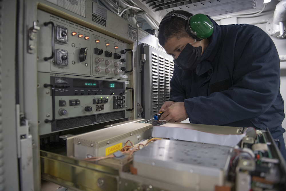INDIAN OCEAN (Jan. 11, 2020) – U.S. Navy Electronics Technician 3rd Class Travis Patterson installs a power supply on the high frequency radio group aboard the amphibious transport dock ship USS San Diego (LPD 22). The San Diego, with the Makin Island Amphibious Ready Group, and the 15th Marine Expeditionary Unit are conducting operations in the U.S. 6th Fleet area of responsibility. U.S. Navy photo by Mass Communication Specialist 2nd Class Brandon Woods